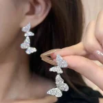 أقراط نسائية شرّابة بفراشة مرصعة بالكريستال، تصميم بوتيك فاخر وأنيق للنساء، مناسبة للزفاف، السهرات، الحفلات، والهدايا