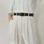 حزام جلد صناعي نسائي أسود بمشبك ذهبي