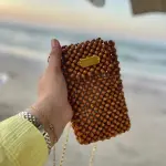 ✨ شنطة هاند ميد من خرز الخشب ✨ لأن التميز في التفاصيل ✨ شنطة مصنوعة يدويًا بكل حب واهتمام، من خرز الخشب الطبيعي، بتصميم أنيق يضيف لمسة فريدة لإطلالتك 💼🌿 مناسبة للمناسبات الخاصة أو الطلات اليومية المميزة القطعة محدودة، وكل شنطة هي عمل فني بحد ذاتها 🎨👜