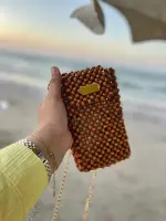 ✨ شنطة هاند ميد من خرز الخشب ✨ لأن التميز في التفاصيل ✨ شنطة مصنوعة يدويًا بكل حب واهتمام، من خرز الخشب الطبيعي، بتصميم أنيق يضيف لمسة فريدة لإطلالتك 💼🌿 مناسبة للمناسبات الخاصة أو الطلات اليومية المميزة القطعة محدودة، وكل شنطة هي عمل فني بحد ذاتها 🎨👜