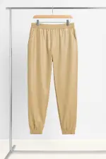 بنطلون نسائي جلد صناعي لامع بخصر مطاط ماركة R&B، تصميم رياضي أنيق لإطلالة عصرية