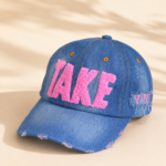 قبعة كاب جينز "TAKE" - تصميم "ديستريسد" مع تفاصيل وردية